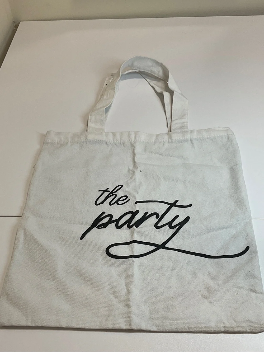 Reusable White Canvas Tote Bag with Black Script - The Party